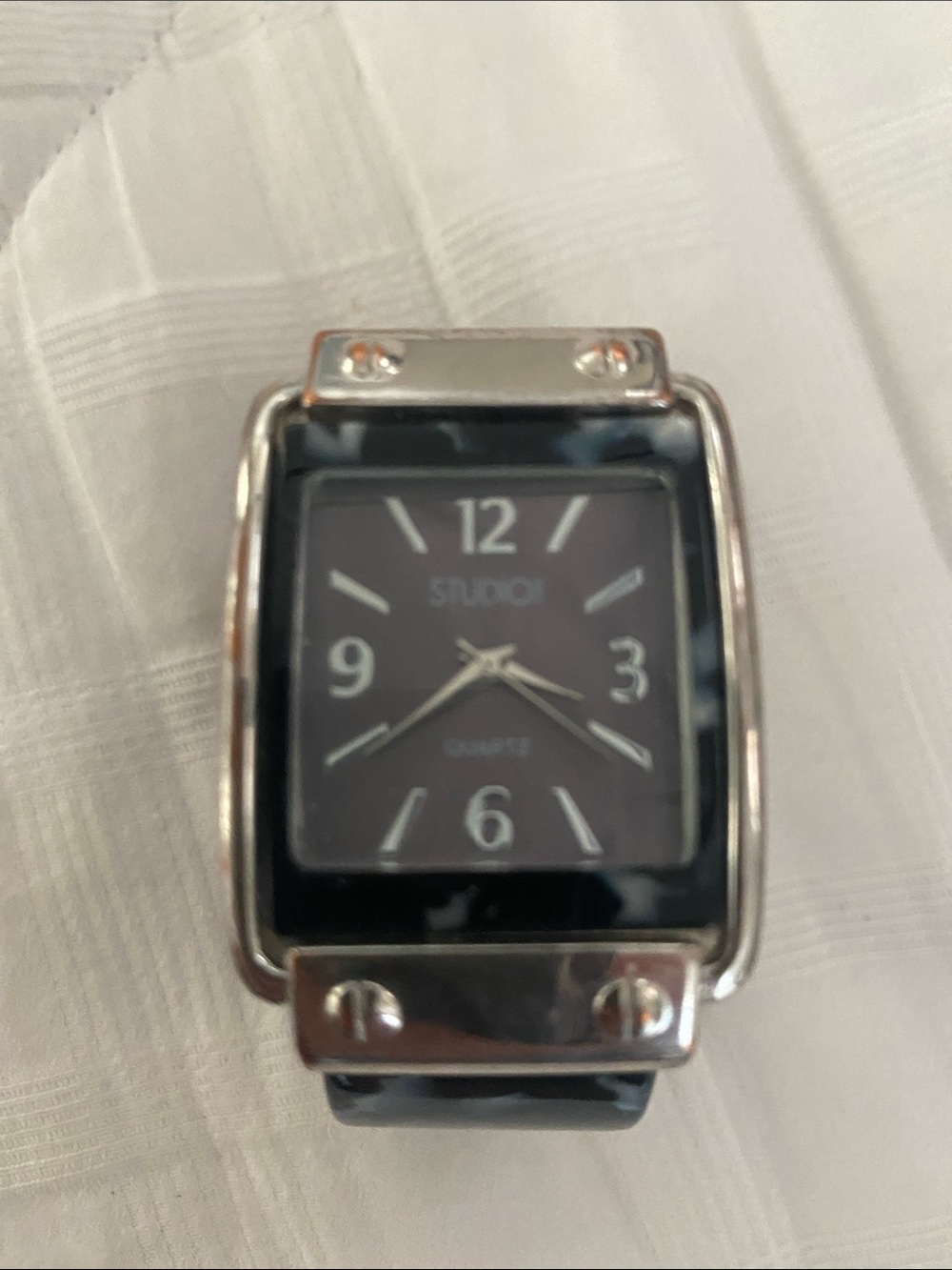 Studio Black and white women’s Rectangular cuff Watch. Needs battery.